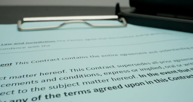 A contract is signed by a lawyer and a pen photo