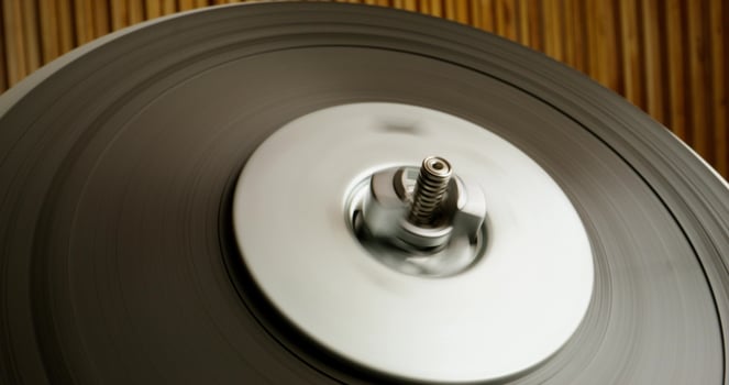 Sound recording on a tape recorder in a recording studio. Fast movement of the magnetic tape, close-up - magnetic photo