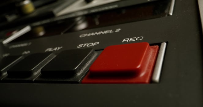 The man presses the rec button photo