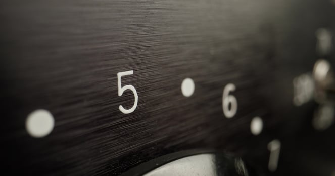 A close up of a black dial with numbers on it photo