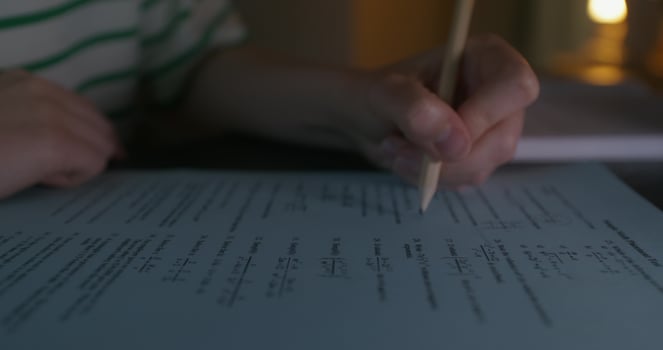 A woman solves math problems photo