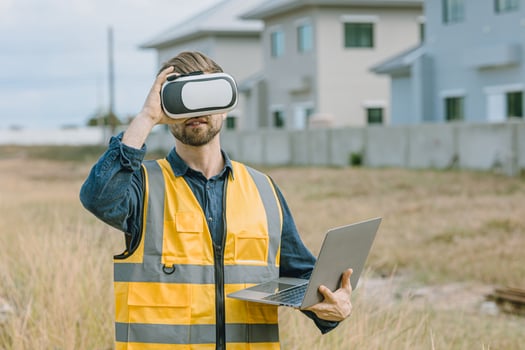 Modern Engineer male using VR visual reality technology in construction industry. photo