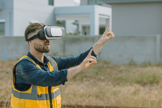 Engineer man worker using VR visual reality technology in construction industry. photo