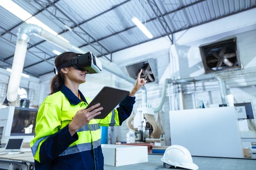 VR. Modern Factory Innovation Technology in Industry, Technician using VR Virtual Reality Headset photo