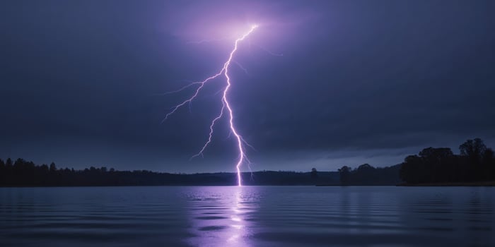 Dramatic nighttime scene of lightning striking over a lake. photo