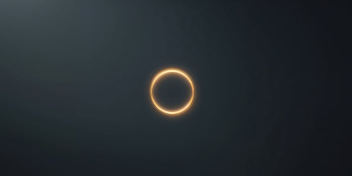 Glowing Golden Circle on Black Background photo