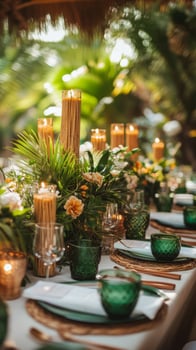 A tropical wedding table setting with green and gold decorations photo