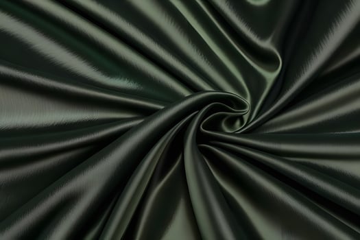 Dark Green Silk Fabric Swirls Luxurious Texture and Deep Emerald Hues photo