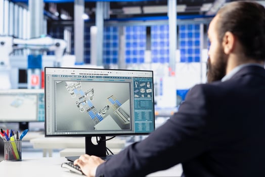 Production manager in solar technology factory reviewing system logs on computer to identify and address operational inefficiencies. Photovoltaic plant employee monitoring data on PC screen, close up photo