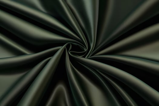 Elegant Dark Green Satin Fabric Swirls Luxurious Texture for backgroundfor backgroundand Deep Color. photo