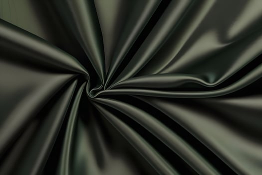 Elegant Texture of Draped Dark Green Satin Fabric photo