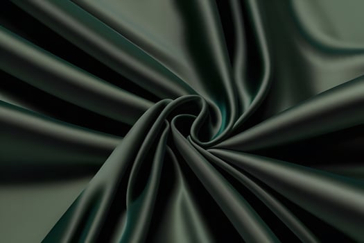 Elegant Emerald Green Silk Fabric Draped Swirls Luxurious Texture and Smooth Surface photo
