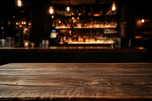 Empty wooden bar top, dark pub interior photo