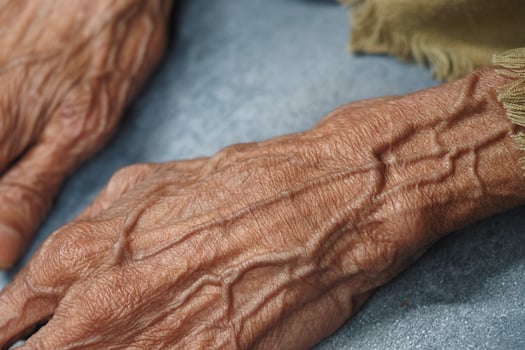 Elders hands showing the passage of time in detailed texture photo