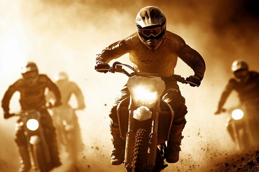 A group of people riding motorcycles on a dirt road photo