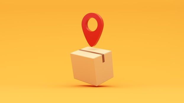 A yellow box with a red pin on it photo