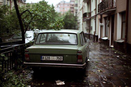 A car parked on a wet street photo