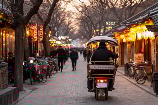 A man riding a motorbike down a street photo
