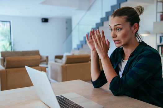 Woman sitting in living room using laptop looking at cam talk by call with business friend relatives, head shot. Job interview answering questions photo