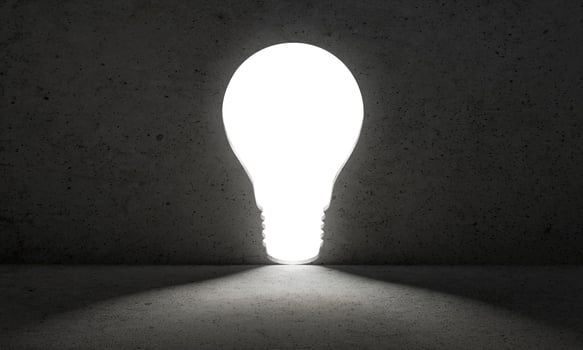 Light from light bulb door. dark wall. business concept1 photo