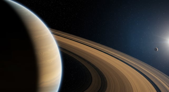 A breathtaking view showcases Saturn's rings, a celestial body, and a distant moon. photo
