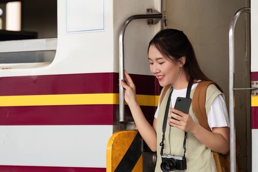 Travel and Adventure. A young woman disembarking from a train, ready for her next journey. photo