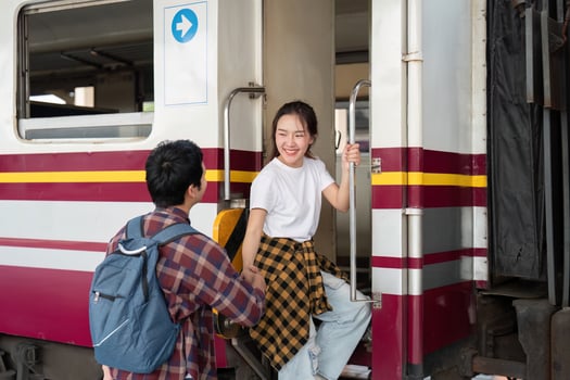 Travel and Togetherness. A couple boarding a train, highlighting their journey ahead. photo