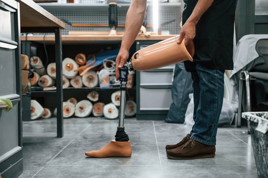 Prosthesis ,on the floor. Technician working in modern laboratory photo