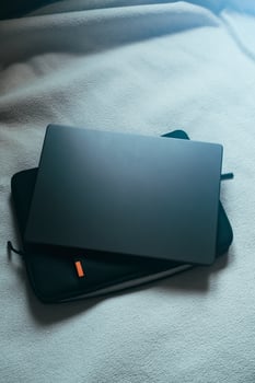 Flat lay view of desktop laptop above case. Workplace with empty space for text. photo