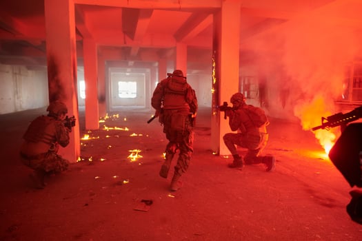 A group of professional soldiers bravely executes a dangerous rescue mission, surrounded by fire in a perilous building. photo