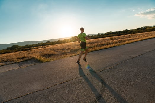 Triathlete in professional gear running early in the morning, preparing for a marathon, dedication to sport and readiness to take on the challenges of a marathon. photo