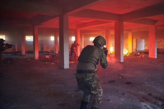A group of professional soldiers bravely executes a dangerous rescue mission, surrounded by fire in a perilous building. photo
