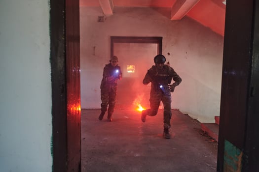 A group of professional soldiers bravely executes a dangerous rescue mission, surrounded by fire in a perilous building. photo