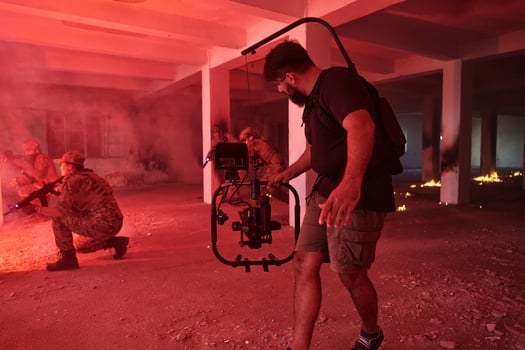 A professional cameraman captures the intense moments as a group of skilled soldiers embarks on a dangerous mission inside an abandoned building, their actions filled with suspense and bravery photo