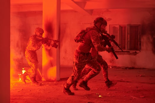 A group of professional soldiers bravely executes a dangerous rescue mission, surrounded by fire in a perilous building. photo