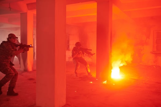 A group of professional soldiers bravely executes a dangerous rescue mission, surrounded by fire in a perilous building. photo