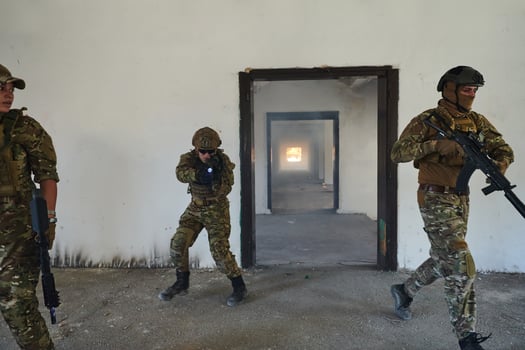 A group of professional soldiers bravely executes a dangerous rescue mission, surrounded by fire in a perilous building. photo