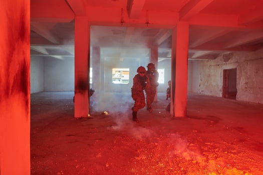 A group of professional soldiers bravely executes a dangerous rescue mission, surrounded by fire in a perilous building. photo