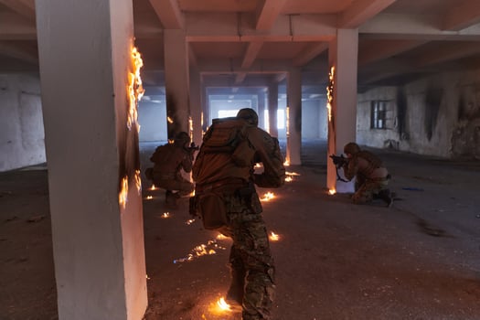 A group of professional soldiers bravely executes a dangerous rescue mission, surrounded by fire in a perilous building. photo