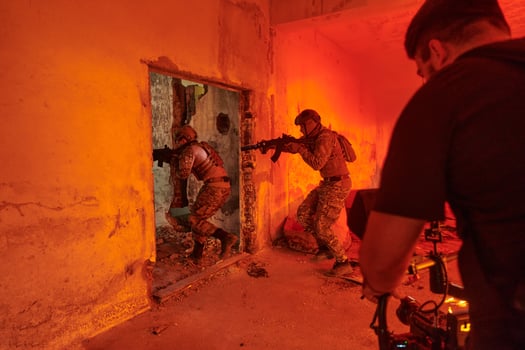 A professional cameraman captures the intense moments as a group of skilled soldiers embarks on a dangerous mission inside an abandoned building, their actions filled with suspense and bravery photo
