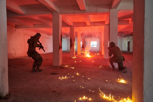 A group of professional soldiers bravely executes a dangerous rescue mission, surrounded by fire in a perilous building. photo