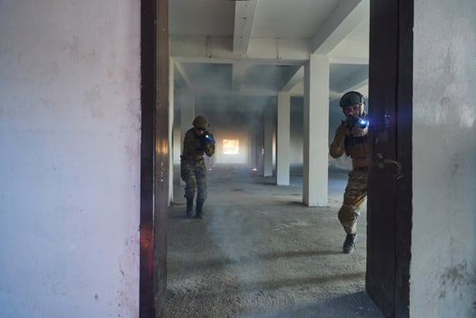 A group of professional soldiers bravely executes a dangerous rescue mission, surrounded by fire in a perilous building. photo