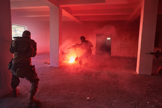 A group of professional soldiers bravely executes a dangerous rescue mission, surrounded by fire in a perilous building. photo
