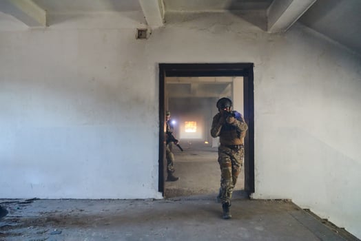 A group of professional soldiers bravely executes a dangerous rescue mission, surrounded by fire in a perilous building. photo