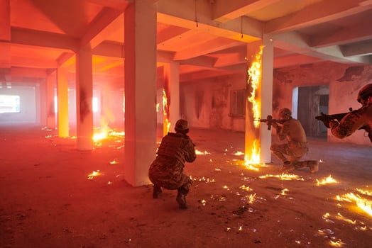 A group of professional soldiers bravely executes a dangerous rescue mission, surrounded by fire in a perilous building. photo