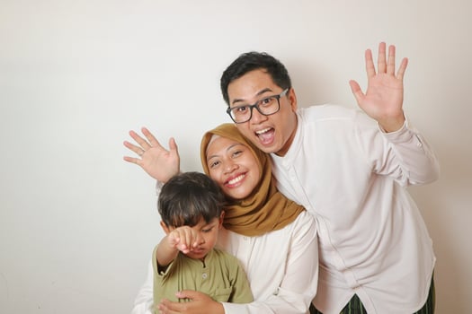 Asian family muslim with one children isolated over white background photo