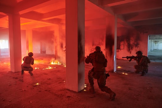 A group of professional soldiers bravely executes a dangerous rescue mission, surrounded by fire in a perilous building. photo