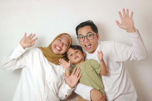 Potrait of happy Asian family play together on isolated white background photo