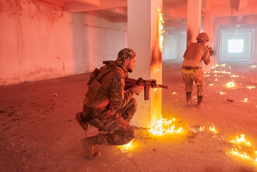 A group of professional soldiers bravely executes a dangerous rescue mission, surrounded by fire in a perilous building. photo