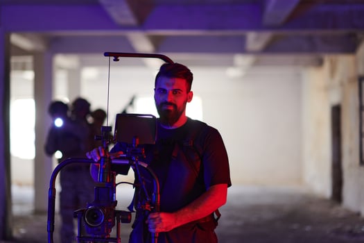 A professional cameraman captures the intense moments as a group of skilled soldiers embarks on a dangerous mission inside an abandoned building, their actions filled with suspense and bravery photo